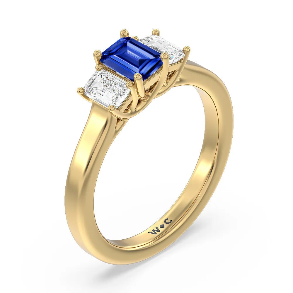 Created Sapphire Center And Emerald Cut Three Stone Diamond Ring