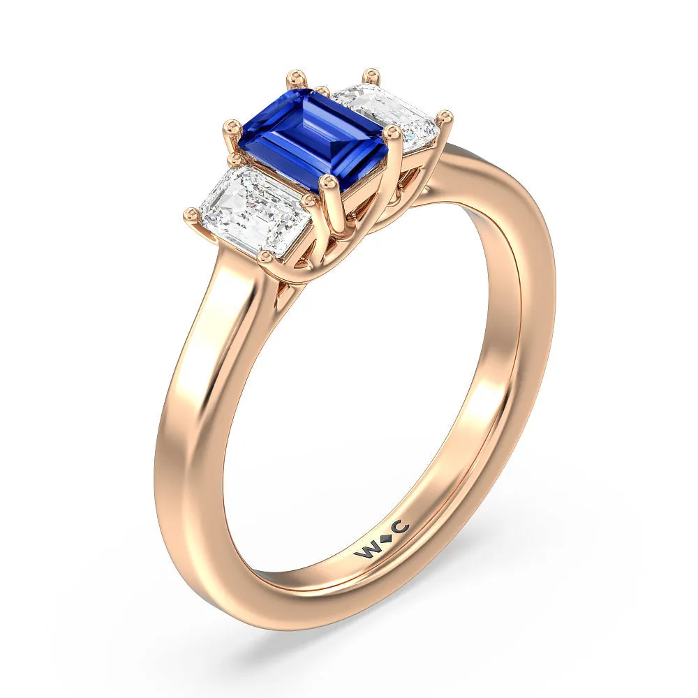 Created Sapphire Center And Emerald Cut Three Stone Diamond Ring