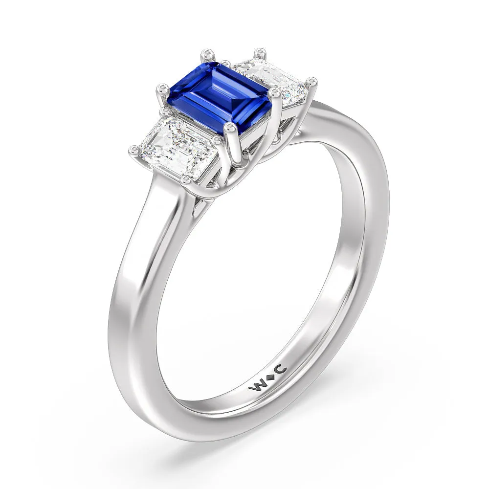 Created Sapphire Center And Emerald Cut Three Stone Diamond Ring