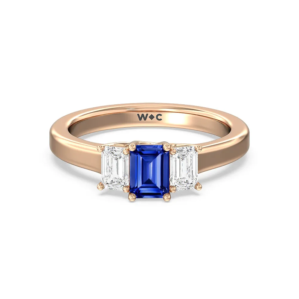 Created Sapphire Center And Emerald Cut Three Stone Diamond Ring
