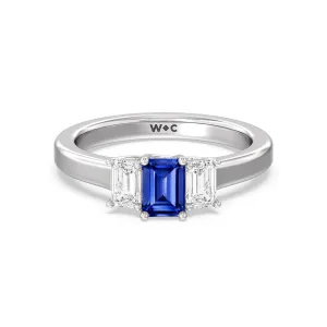 Created Sapphire Center And Emerald Cut Three Stone Diamond Ring