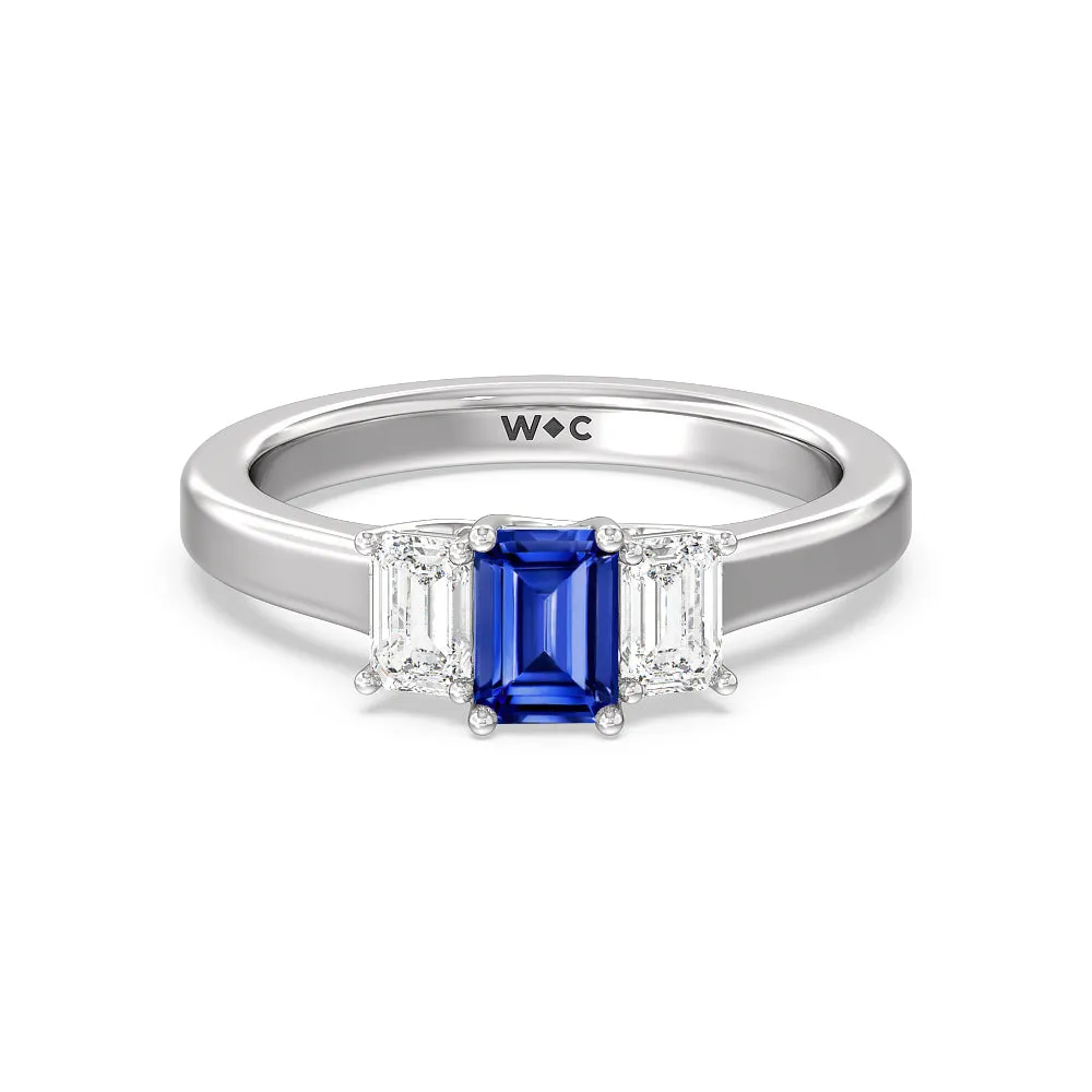 Created Sapphire Center And Emerald Cut Three Stone Diamond Ring