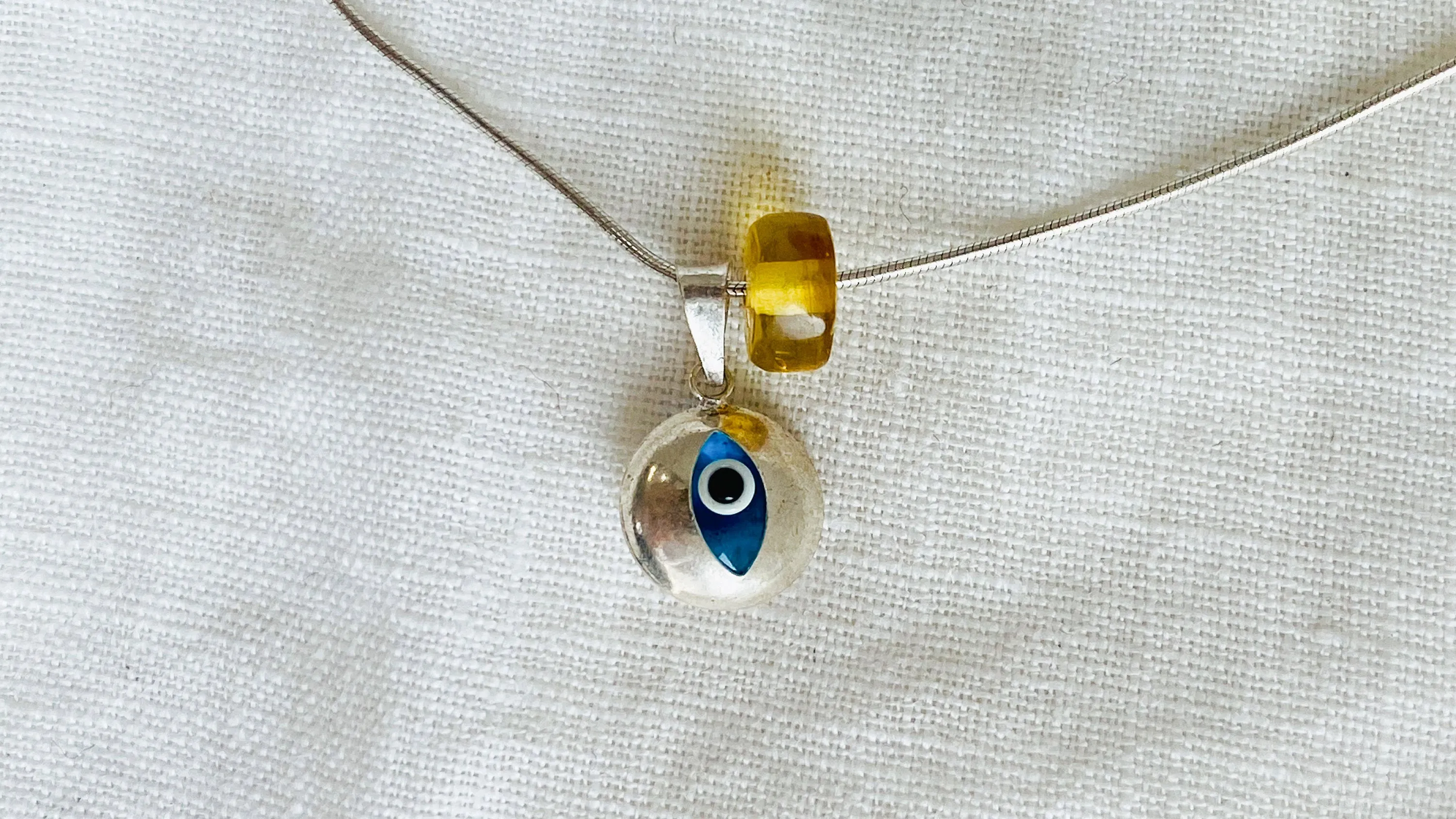 Evil Eye Pendant. Sterling Silver and Amber.