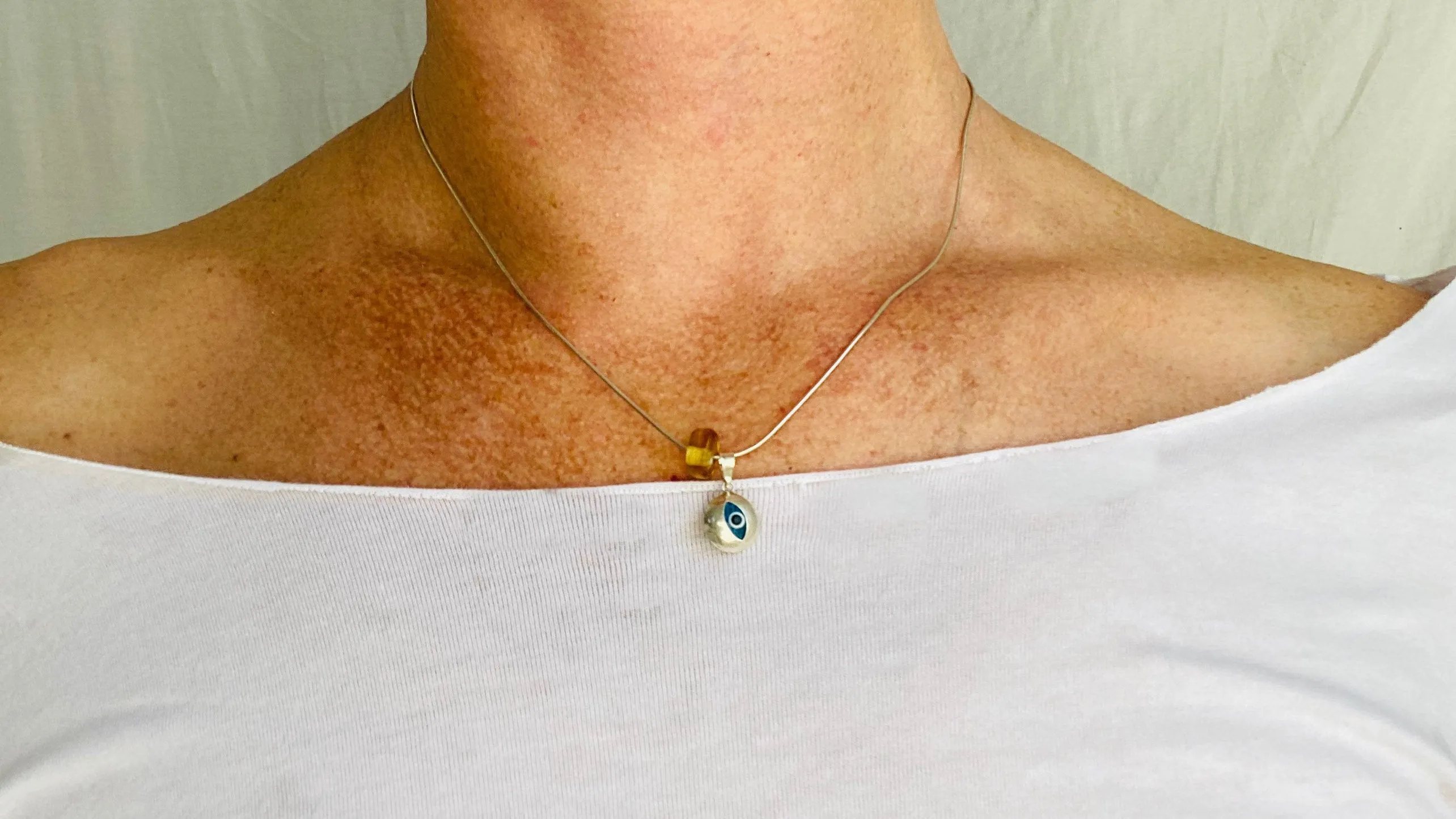 Evil Eye Pendant. Sterling Silver and Amber.